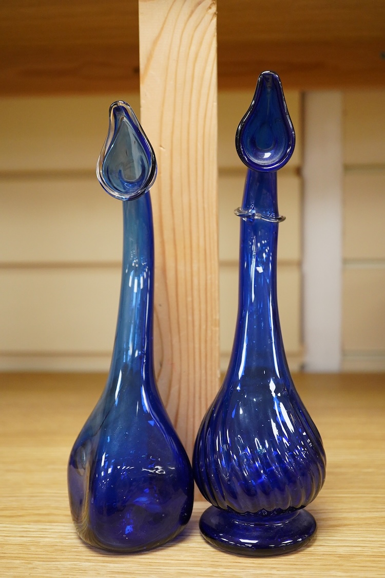 Two Persian blue glass tear catchers, largest 24cm high